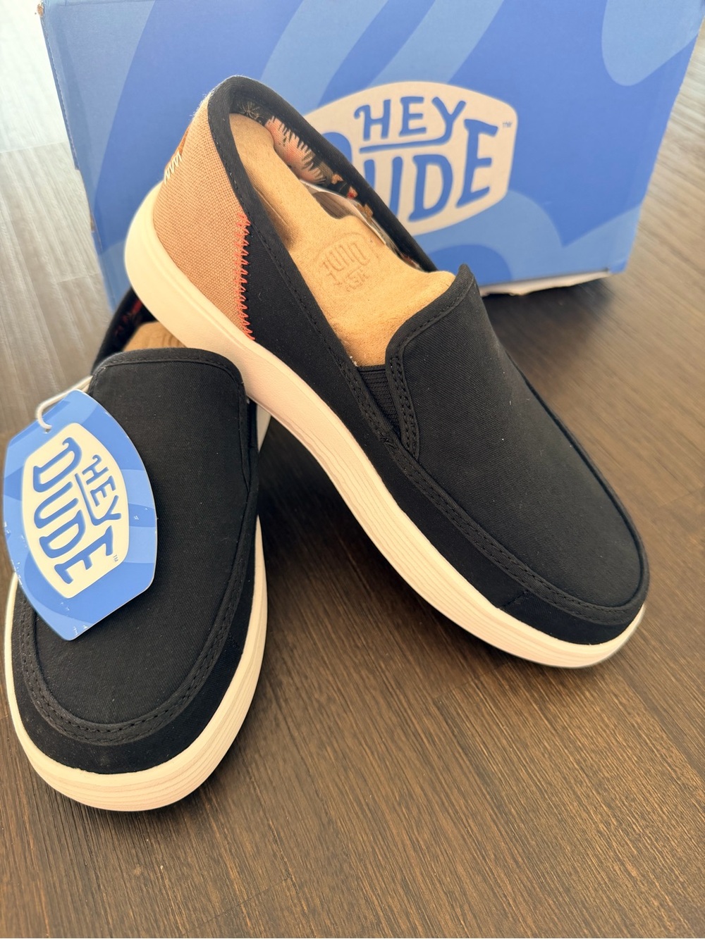 Hey Dude Women’s Black Slip-On Loafers with Tan Heel Panel